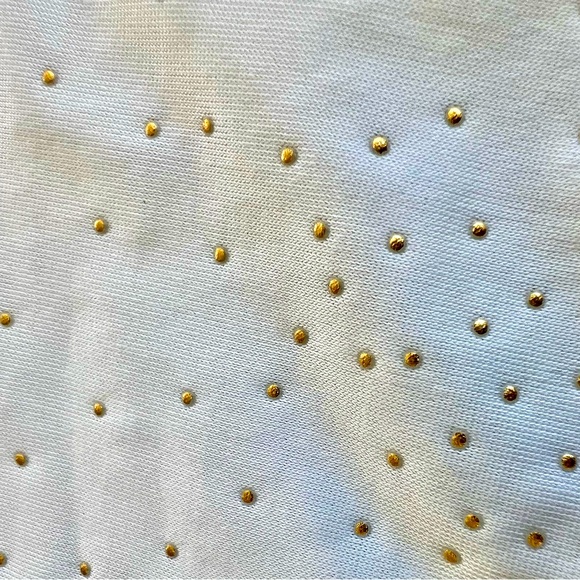 Cream color sleeveless top.Has Gold color Dots and a lace see through back. - Picture 5 of 8